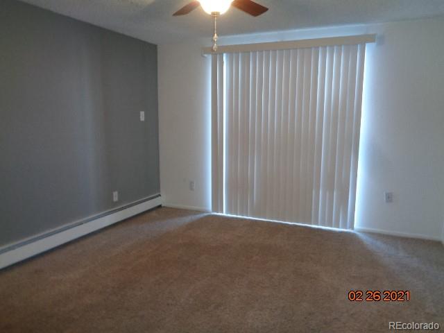 1300 South Parker Road, Unit 112 Denver, CO 80231 - Photo 3 of 15 an empty room with a empty space and a window