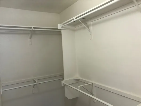 a view of an empty walk in closet