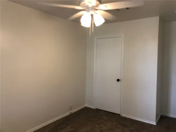 a view of a small space with a fan