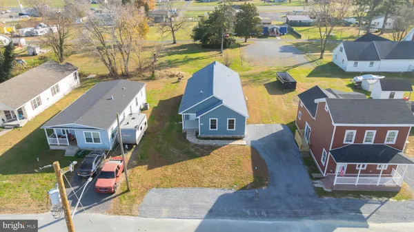 an aerial view of a house with swimming pool
