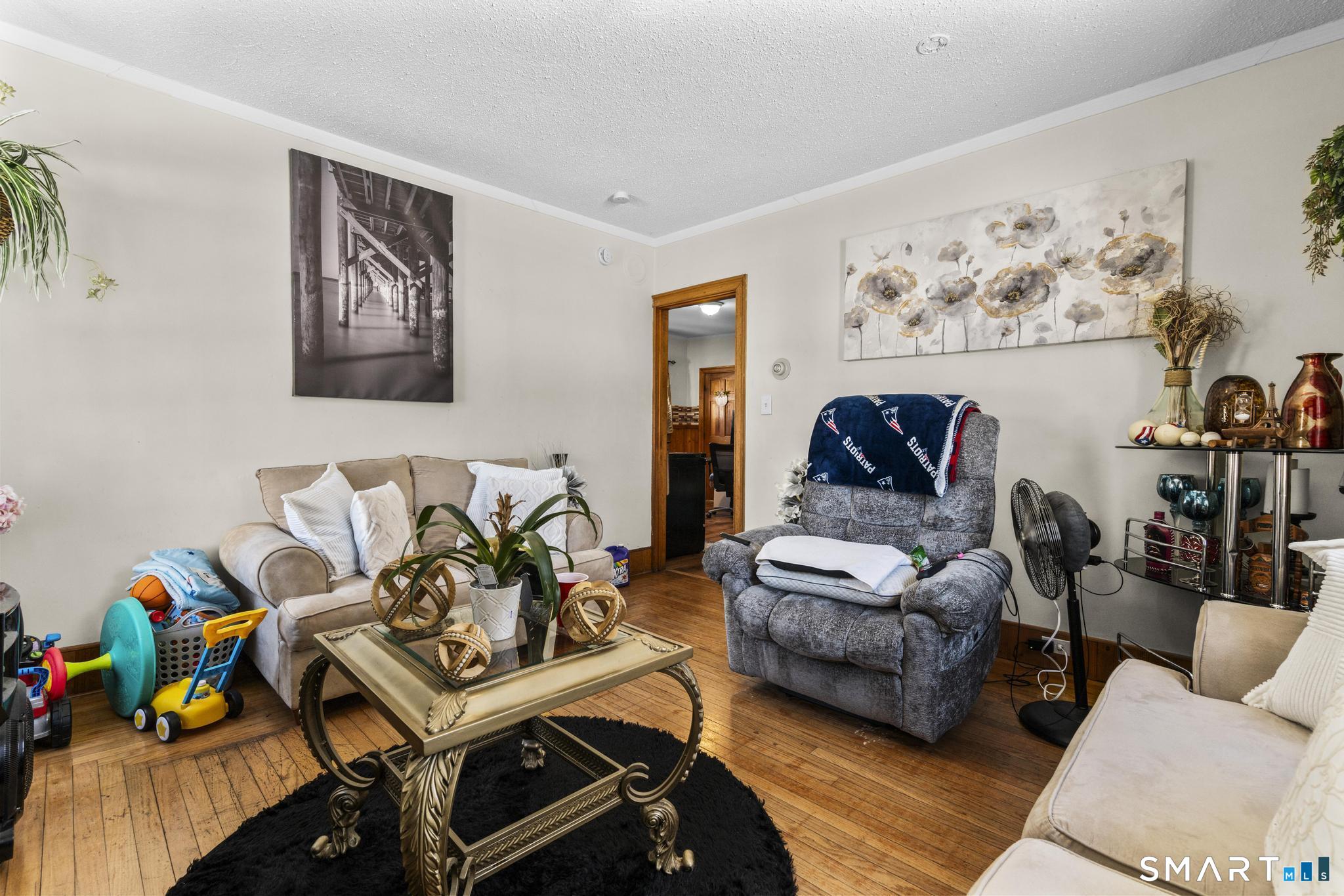 17 Austin Street New Britain, CT 06051 - Photo 12 of 40 a living room with furniture and wooden floor