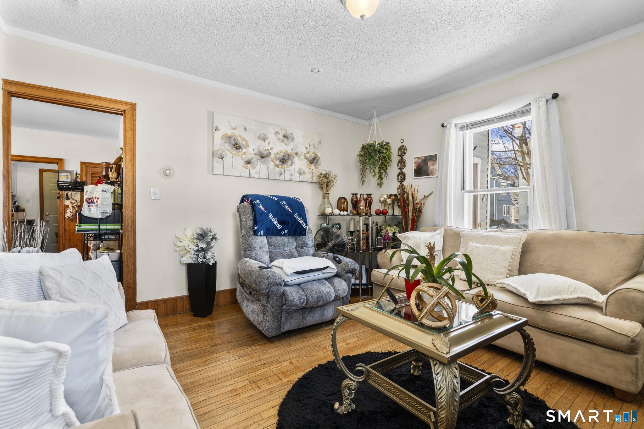 17 Austin Street New Britain, CT 06051 - Photo 13 of 40 a living room with furniture and a large window