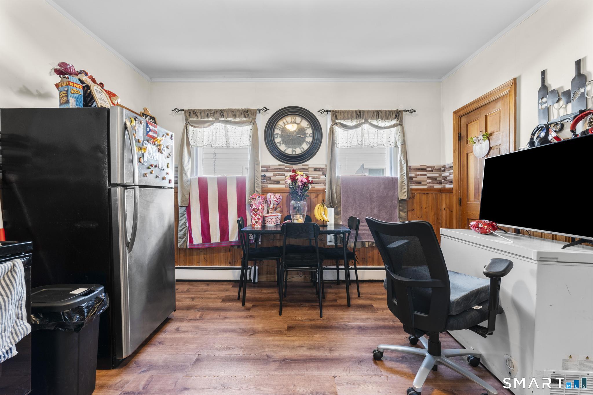 17 Austin Street New Britain, CT 06051 - Photo 17 of 40 a view of a workspace with furniture and a flat screen tv