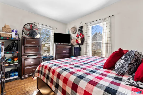 a bedroom with a bed and a dresser