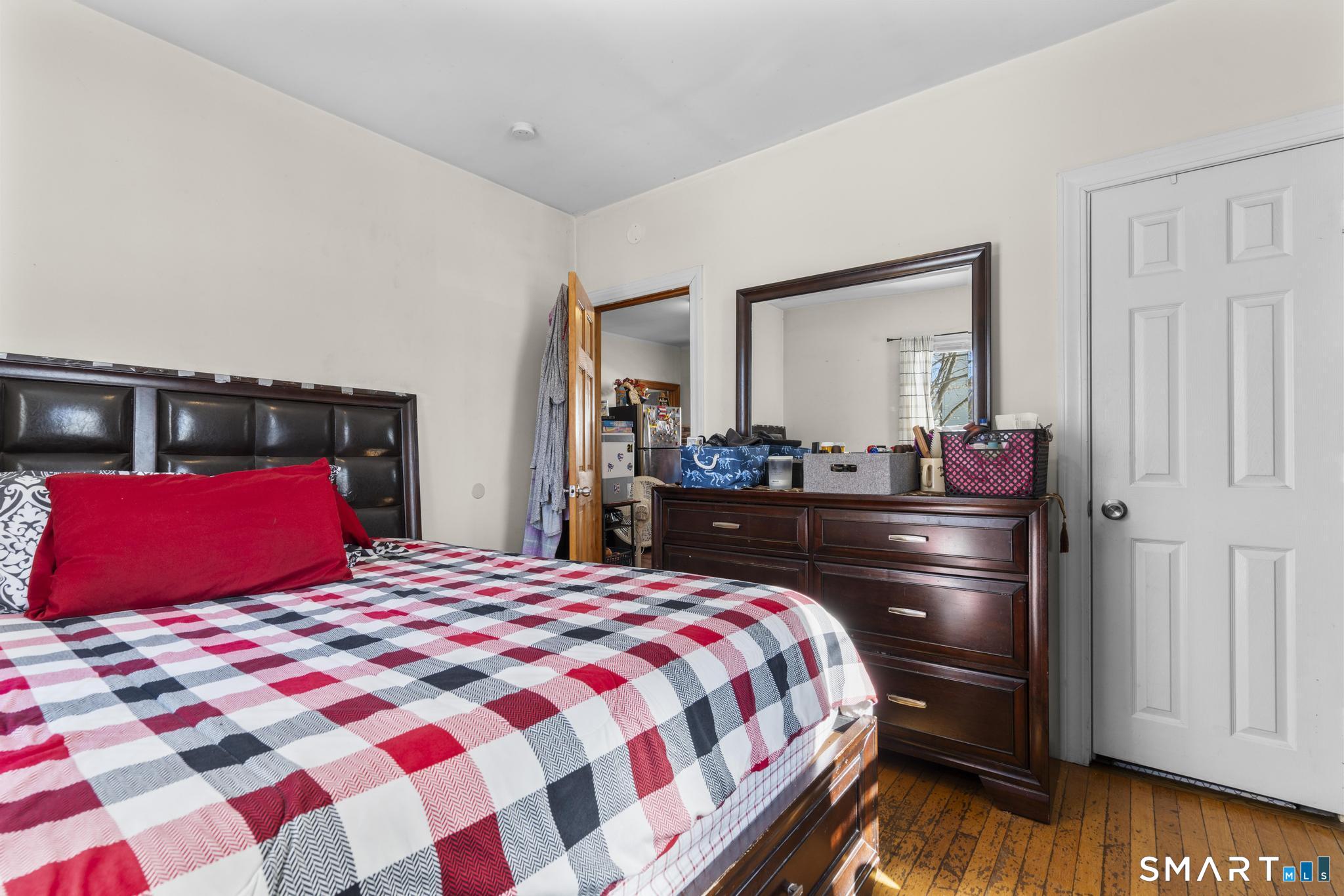 17 Austin Street New Britain, CT 06051 - Photo 19 of 40 a bedroom with a bed and a dresser