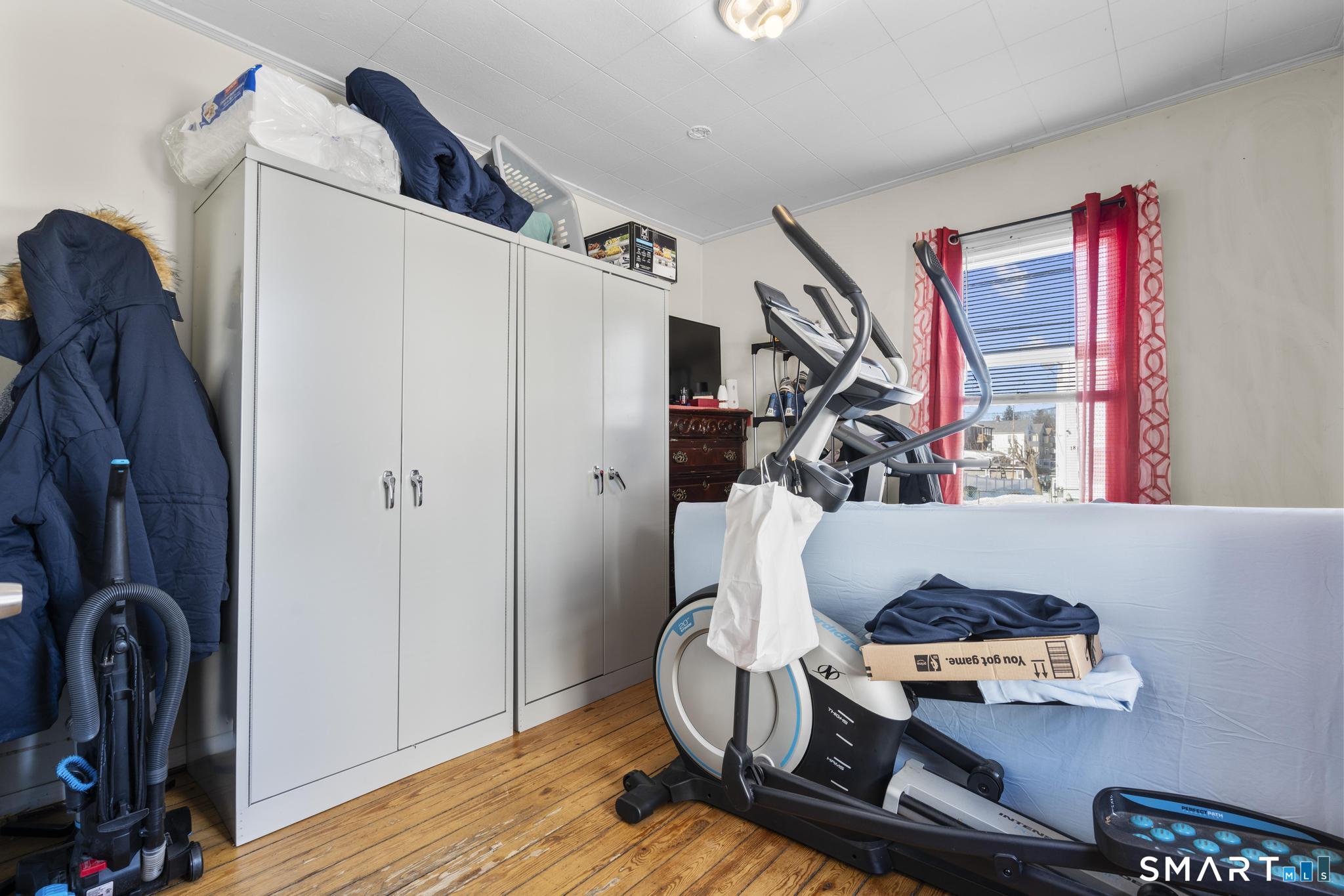 17 Austin Street New Britain, CT 06051 - Photo 20 of 40 a room with furniture and wooden floor