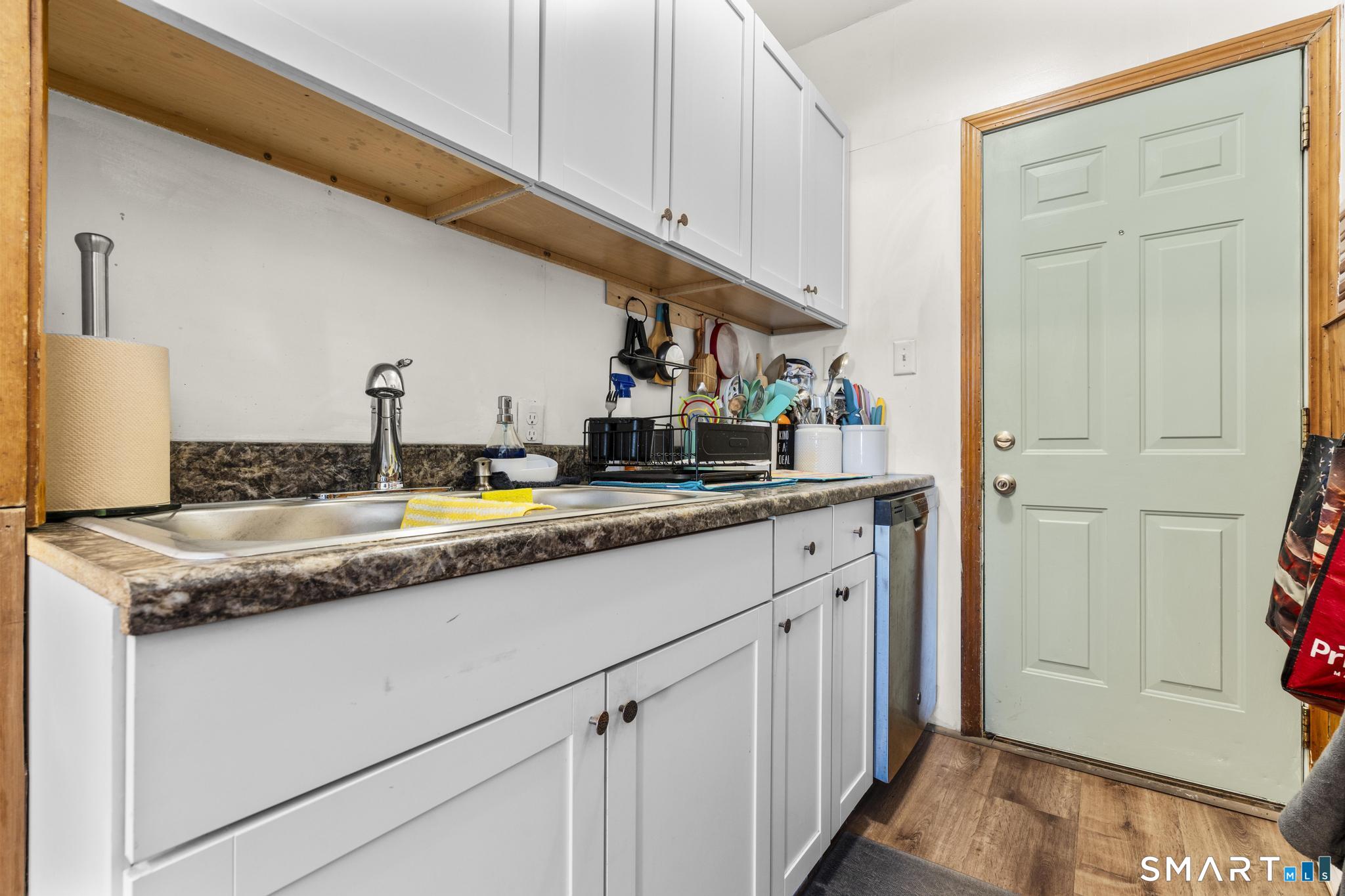 17 Austin Street New Britain, CT 06051 - Photo 21 of 40 a kitchen with granite countertop a sink and a stove