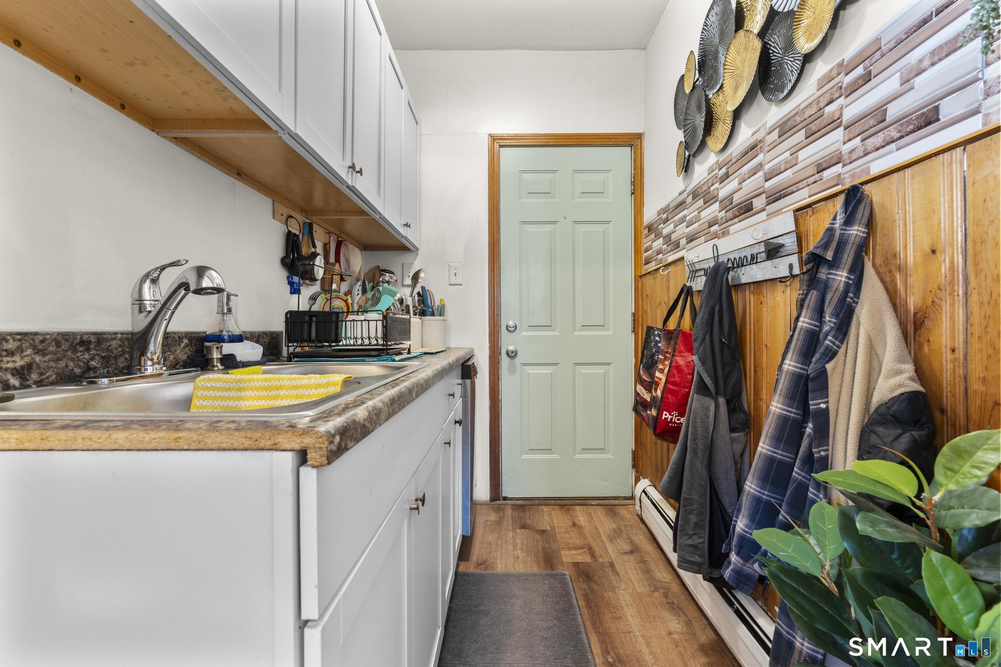 17 Austin Street New Britain, CT 06051 - Photo 22 of 40 a view of walk in closet with clothes and shoes
