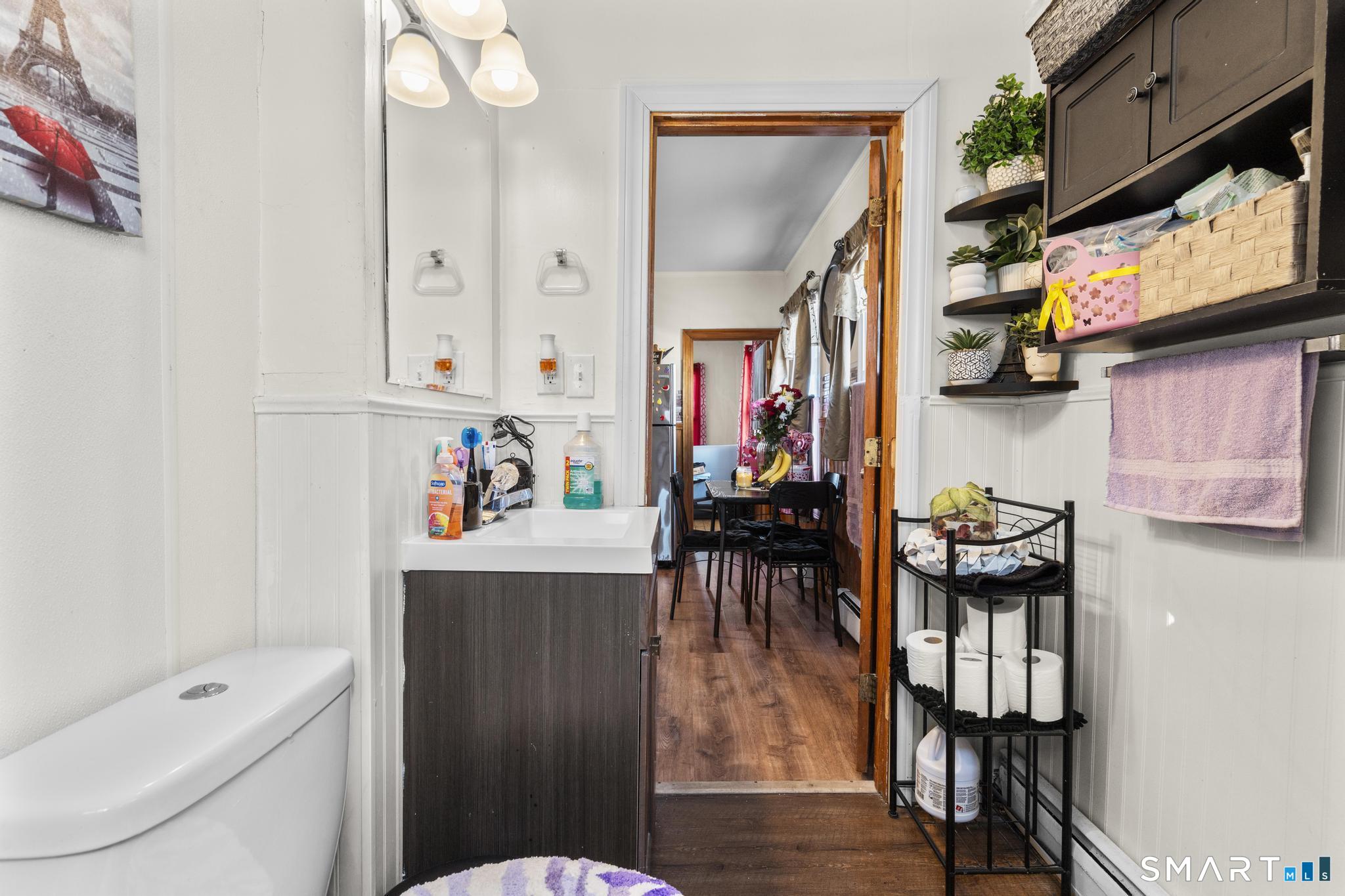 17 Austin Street New Britain, CT 06051 - Photo 23 of 40 a living room with furniture a flat screen tv and a toilet