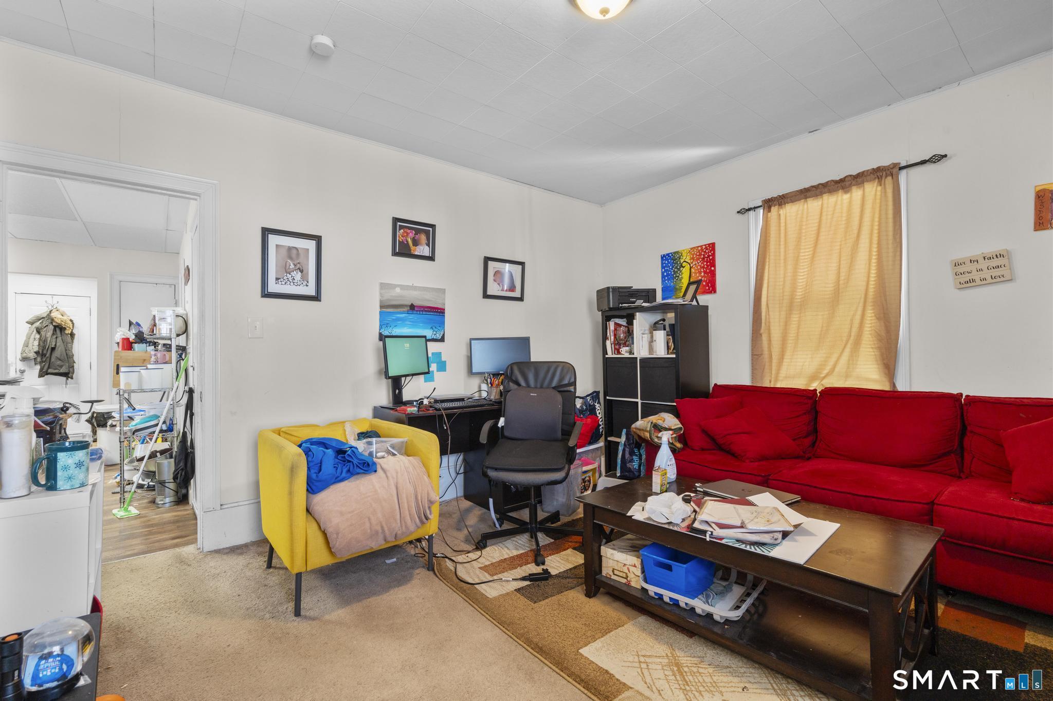 17 Austin Street New Britain, CT 06051 - Photo 26 of 40 a living room with furniture and a window