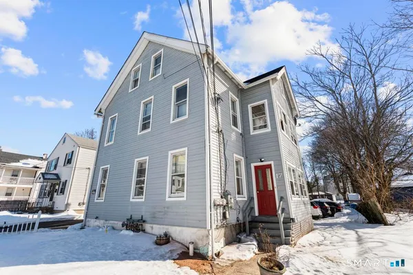 a view of a backyard of the house