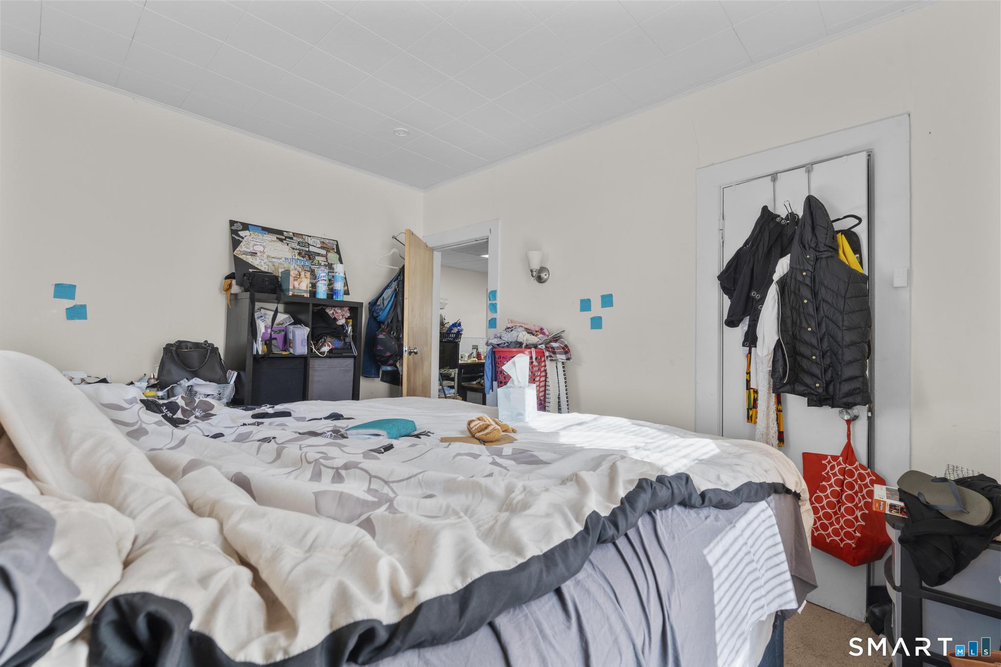 17 Austin Street New Britain, CT 06051 - Photo 36 of 40 a bed room with a bed and a closet