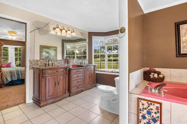 a living room with a couch and a dresser next to a window