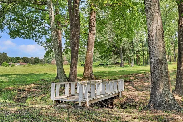 a view of a deck with a yard