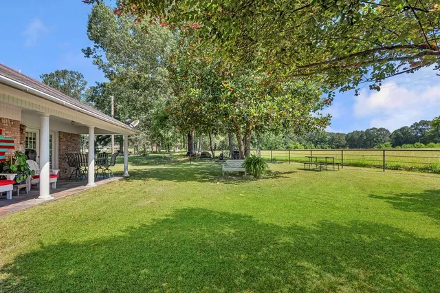 a view of a house with a big yard