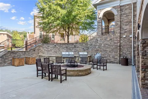 a view of a chairs and table in the patio