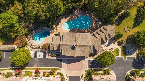 an aerial view of a house with garden and patio
