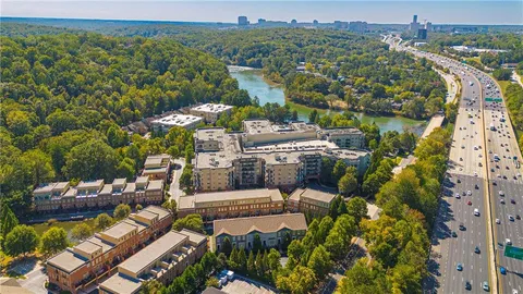 an aerial view of a house with a yard