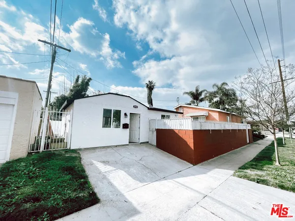 a view of a house with a tub and trees