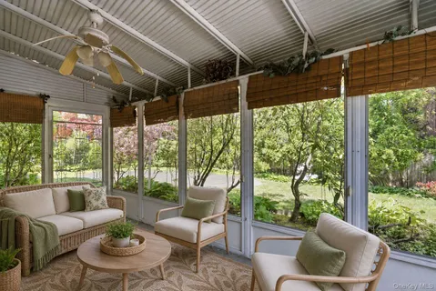 a outdoor living space with furniture and garden view