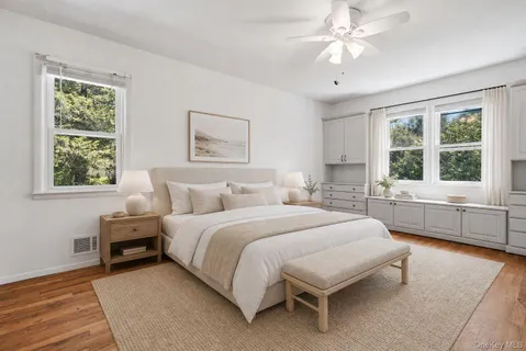 a spacious bedroom with a bed and a window