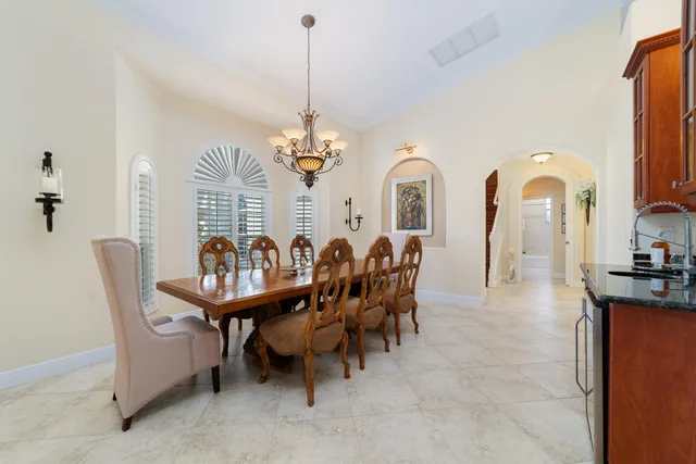 a kitchen with granite countertop stainless steel appliances and wooden cabinets
