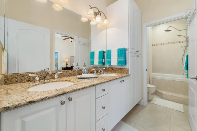 a view of a big building with a big yard and large trees