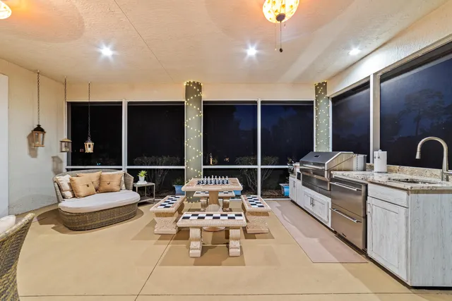 an aerial view of a house with yard swimming pool outdoor seating and outdoor seating