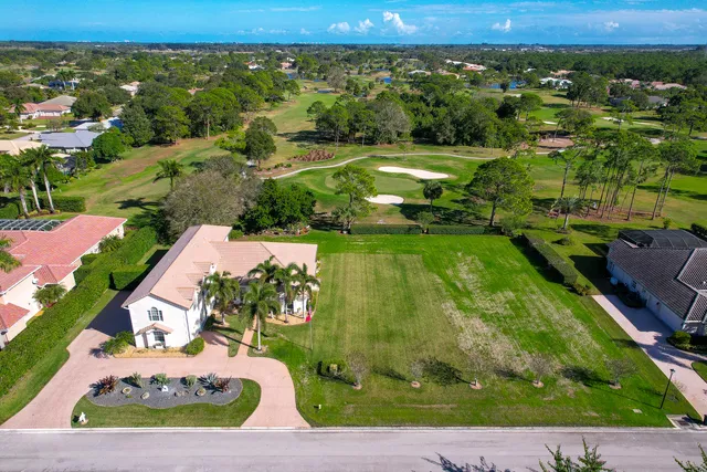 a view of living room filled with furniture and floor to ceiling window