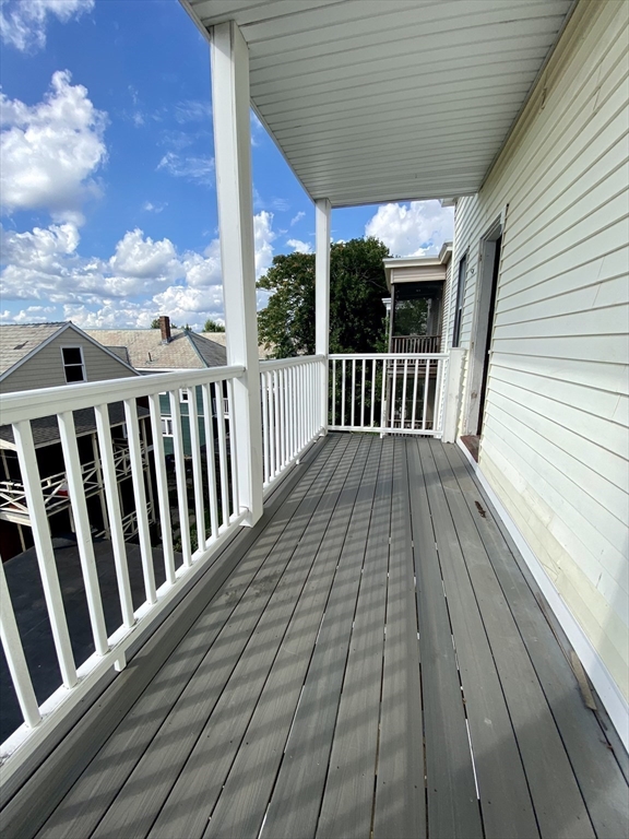 14 Belknap Street, Unit 3 Somerville, MA 02144 - Photo 13 of 25 a view of balcony with wooden floor