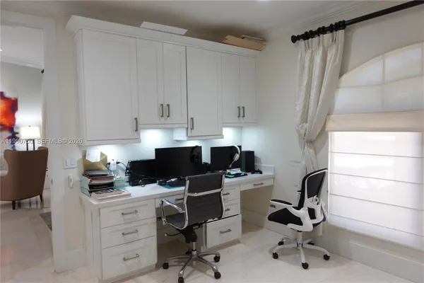 a kitchen view with kitchen island a stove a sink and a refrigerator
