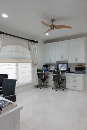 a bathroom with a sink vanity mirror and toilet