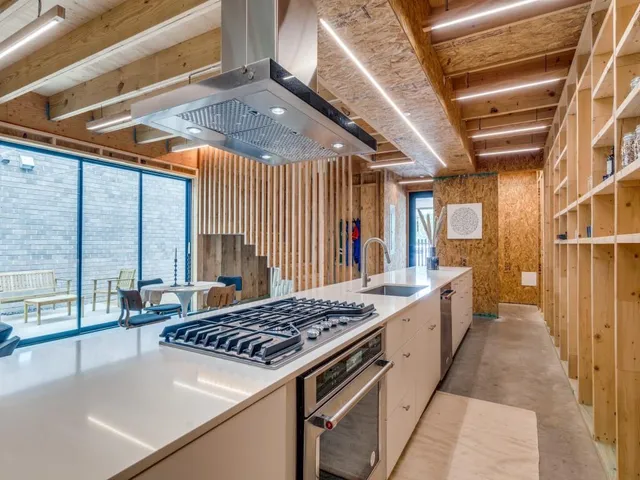 a kitchen with a stove and a refrigerator