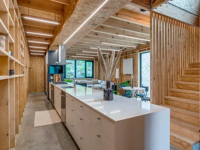 a kitchen with counter top space and sink