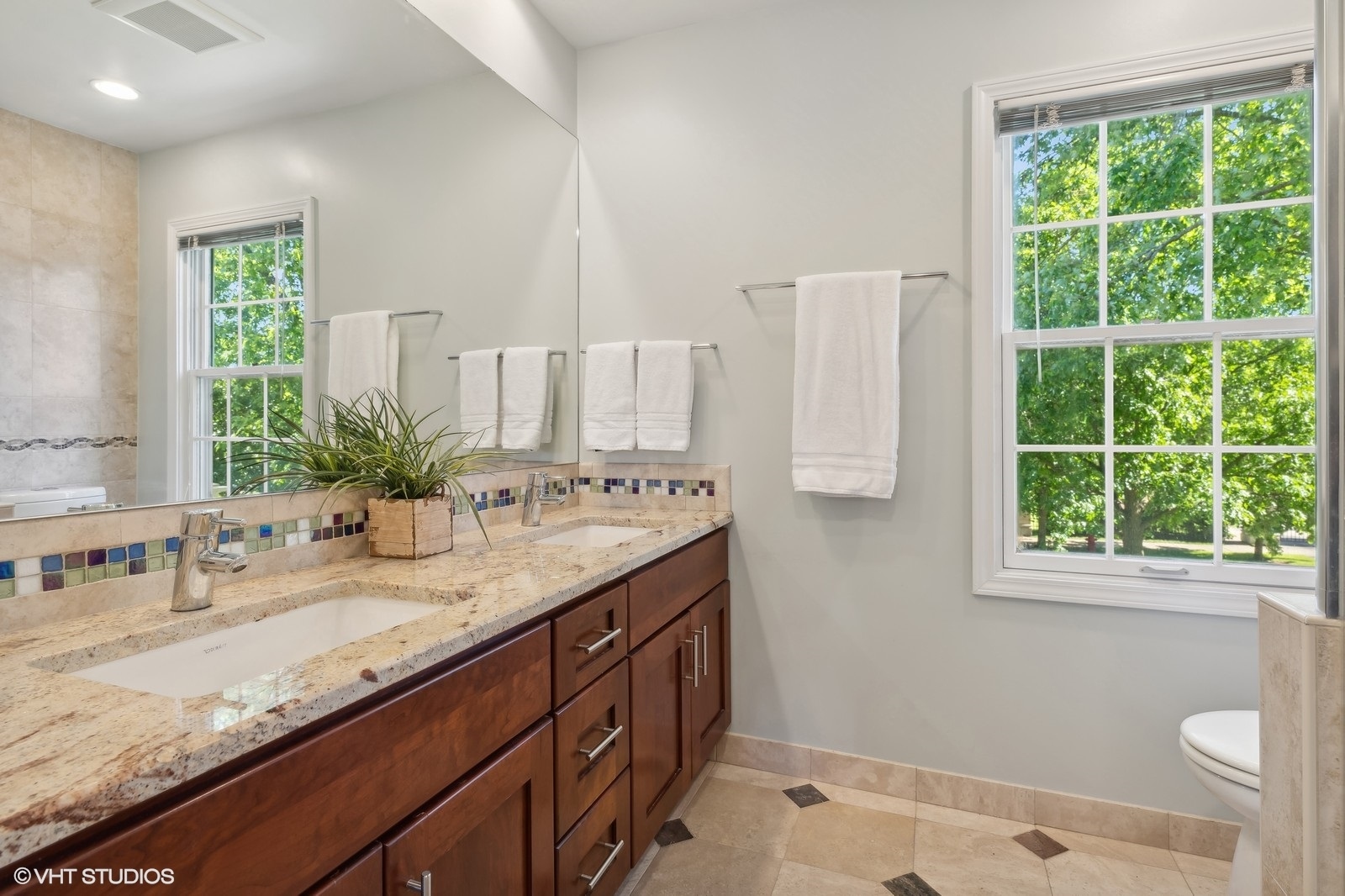 2843 Farmington Road Northbrook, IL 60062 - Photo 18 of 28 a bathroom with a granite countertop sink and a window