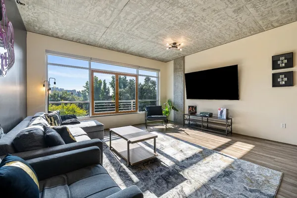a living room with furniture and a flat screen tv