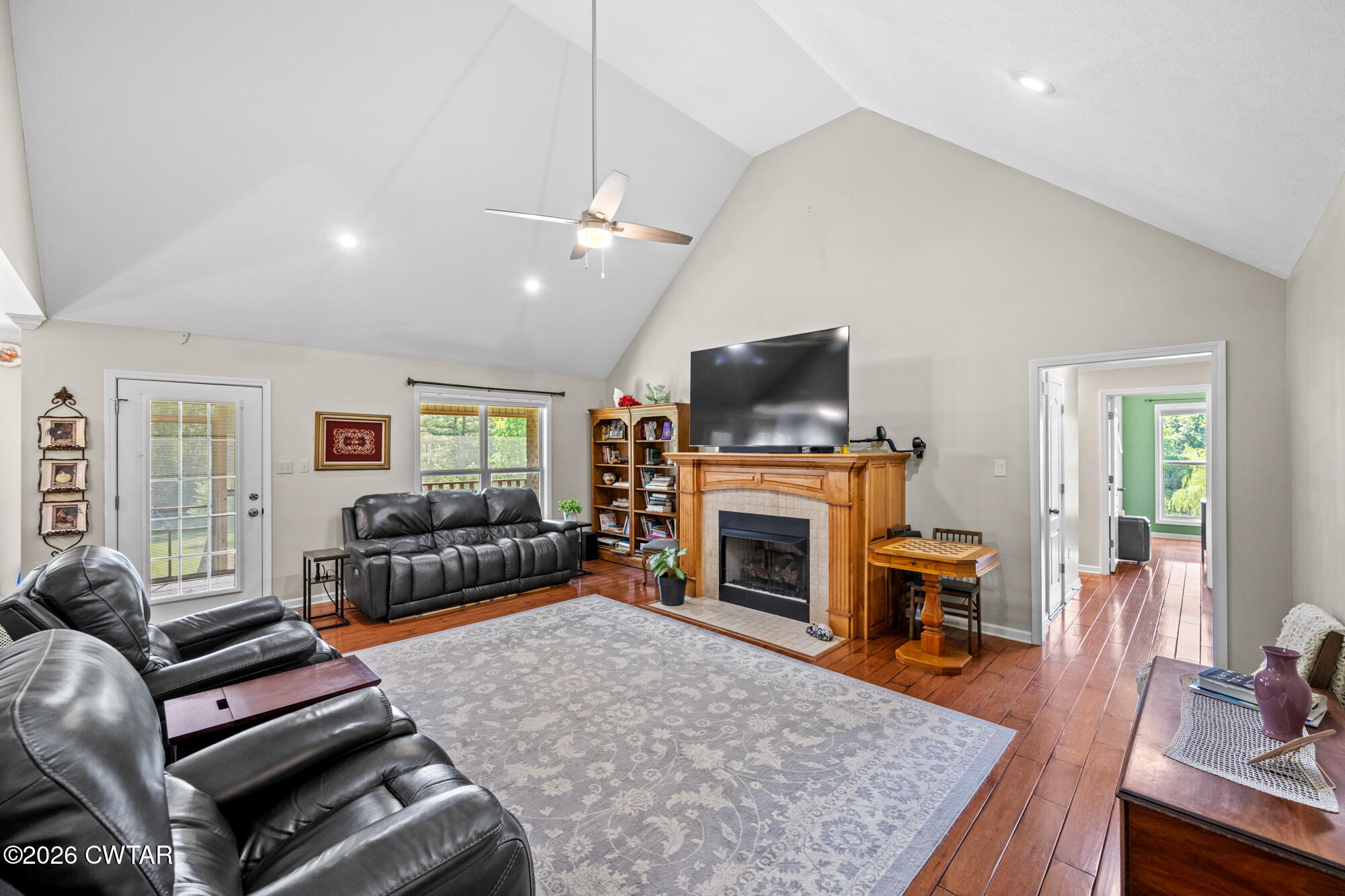 492 Joe Horton Road Lexington, TN 38351 - Photo 7 of 49 a living room with furniture a flat screen tv and a fireplace