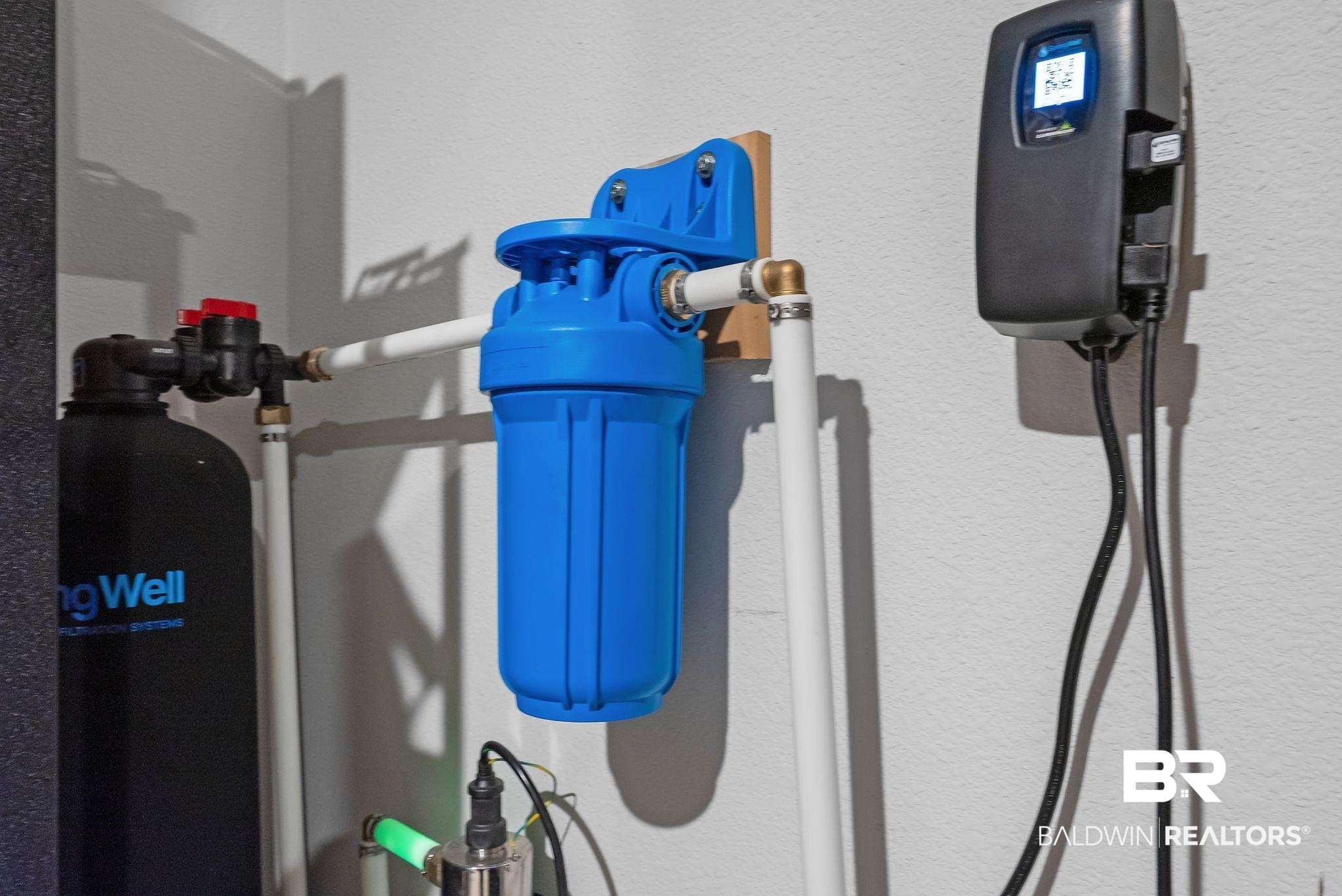 13966 Antler Hl Road Daphne, AL 36527 - Photo 44 of 44 Water filtration system featuring a blue filter housing and a black control unit with a digital display