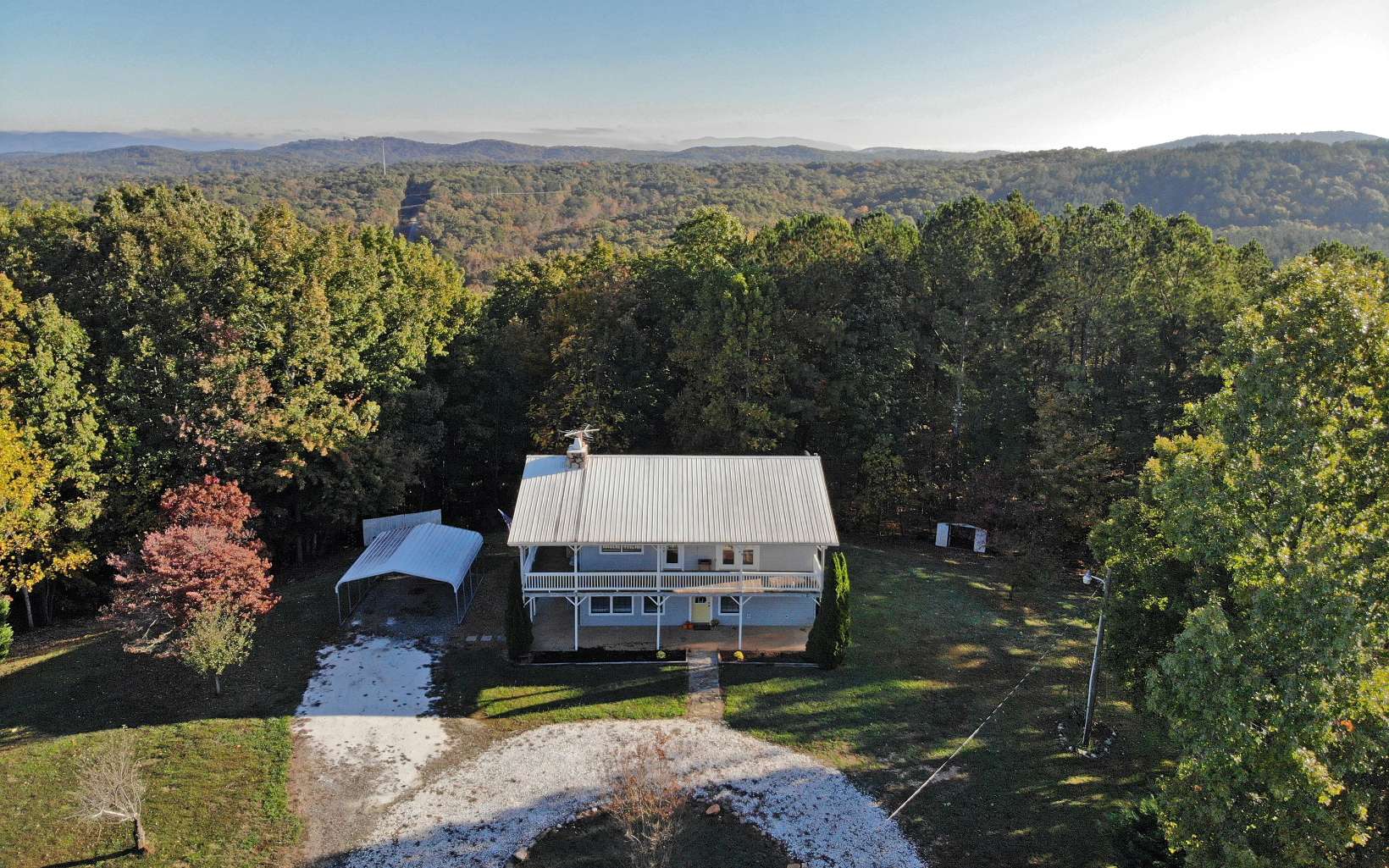 161 Log Round Mountain Road Ellijay, GA 30540 - Photo 1 of 1 an aerial view of a house with a garden