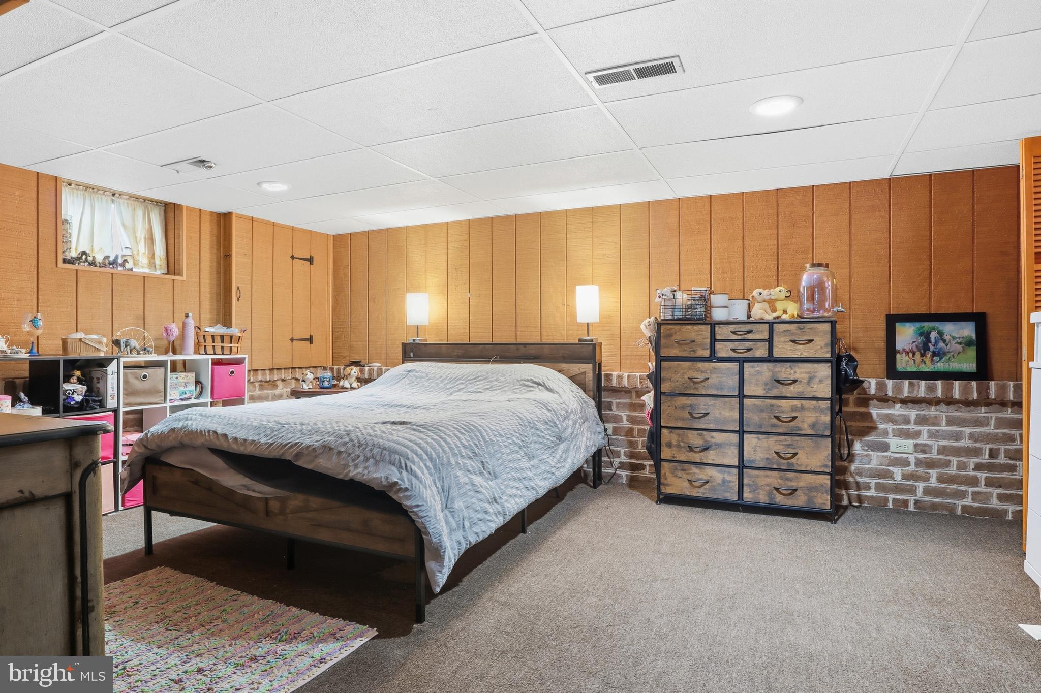 583 Hillcrest Road York, PA 17403 - Photo 18 of 44 a spacious bedroom with a bed a dresser and windows