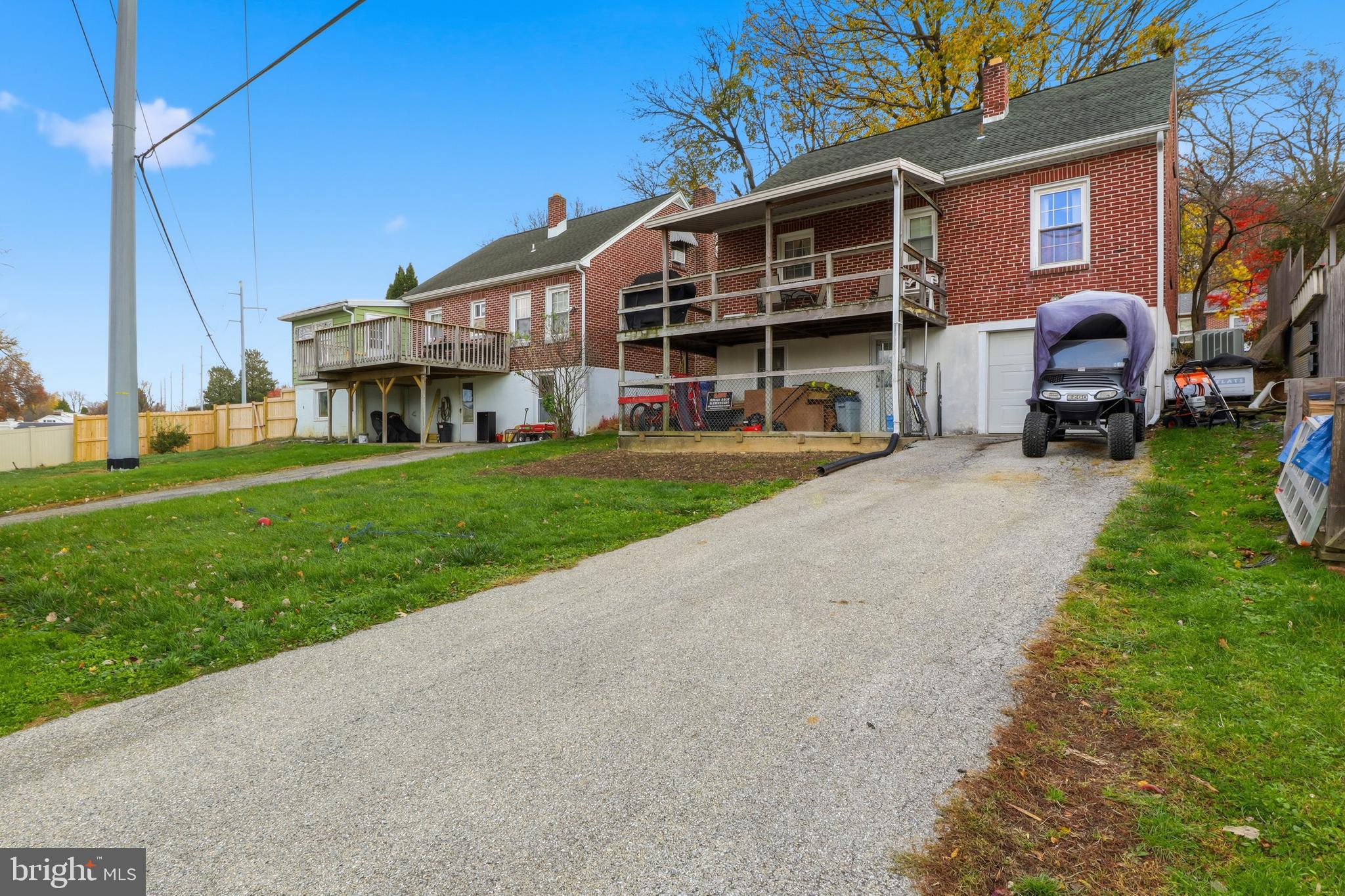 583 Hillcrest Road York, PA 17403 - Photo 30 of 44 a view of a big house with a big yard and large trees