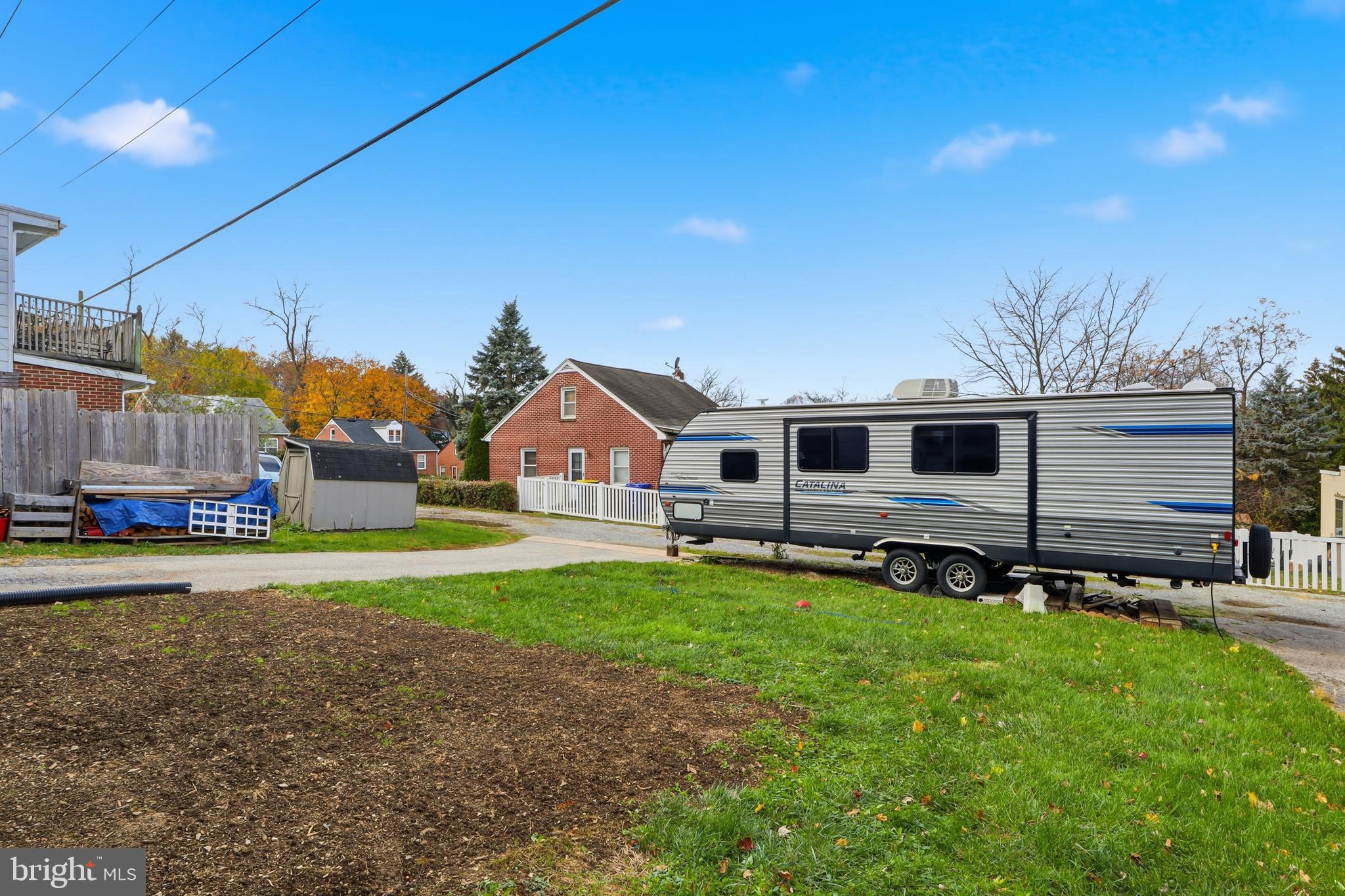 583 Hillcrest Road York, PA 17403 - Photo 32 of 44 a front view of house with yard and trees in the background