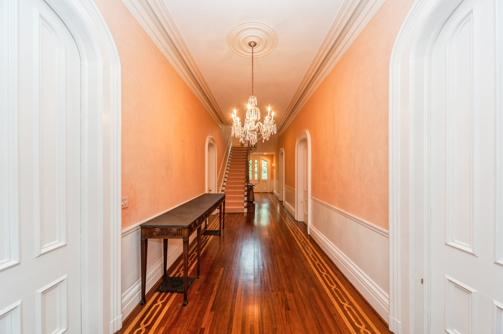 404 East Deerpath Road Lake Forest, IL 60045 - Photo 2 of 44 a view of a hallway with wooden floor and staircase