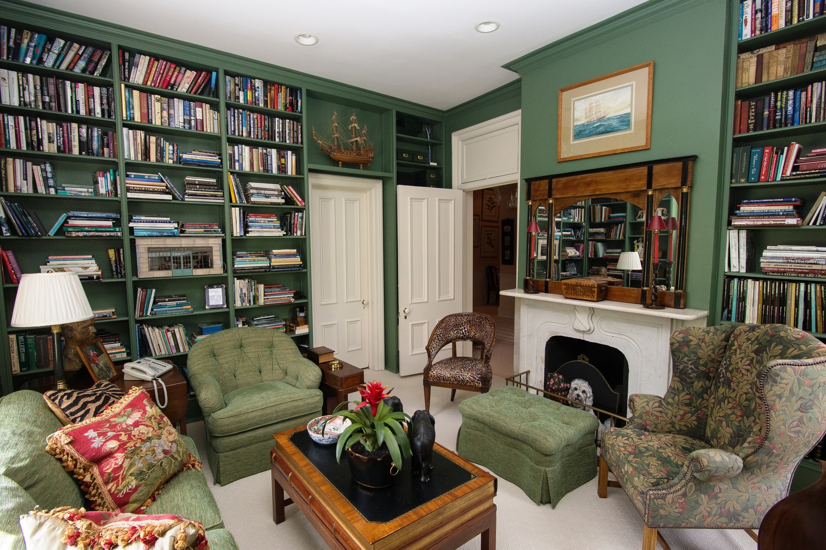 404 East Deerpath Road Lake Forest, IL 60045 - Photo 24 of 44 a living room with furniture a bookshelf and a potted plant
