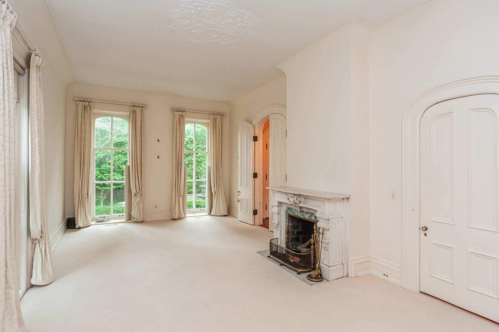 404 East Deerpath Road Lake Forest, IL 60045 - Photo 4 of 44 an empty room with fireplace and windows