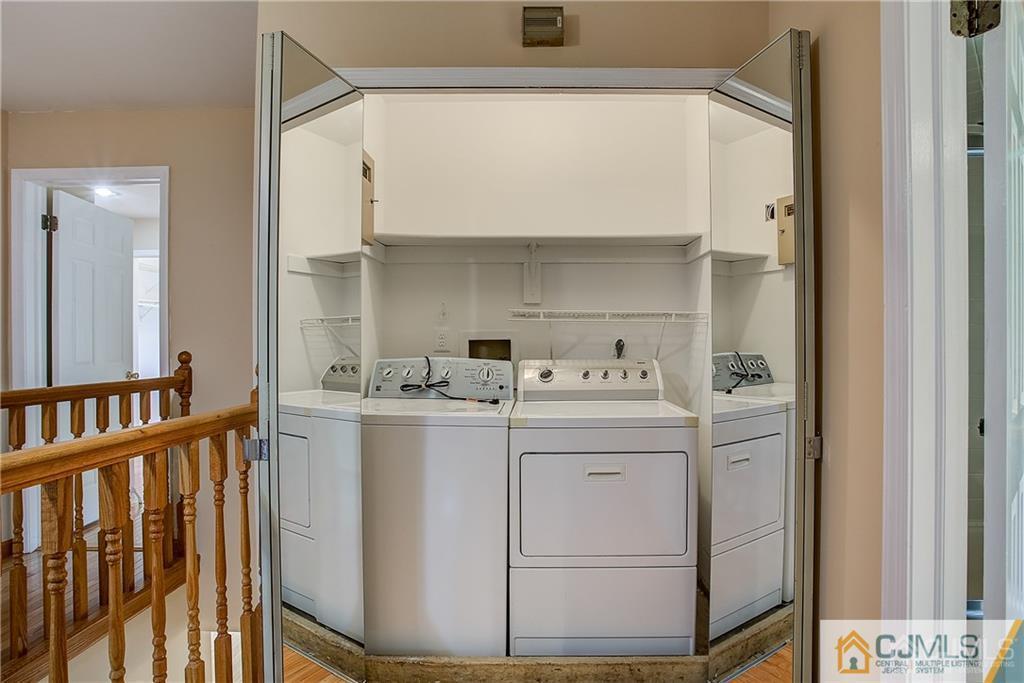 901 Timber Oaks Road Edison, NJ 08820 - Photo 16 of 27 a utility room with dryer and washer