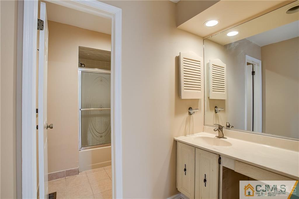 901 Timber Oaks Road Edison, NJ 08820 - Photo 20 of 27 a bathroom with a sink double vanity and a mirror
