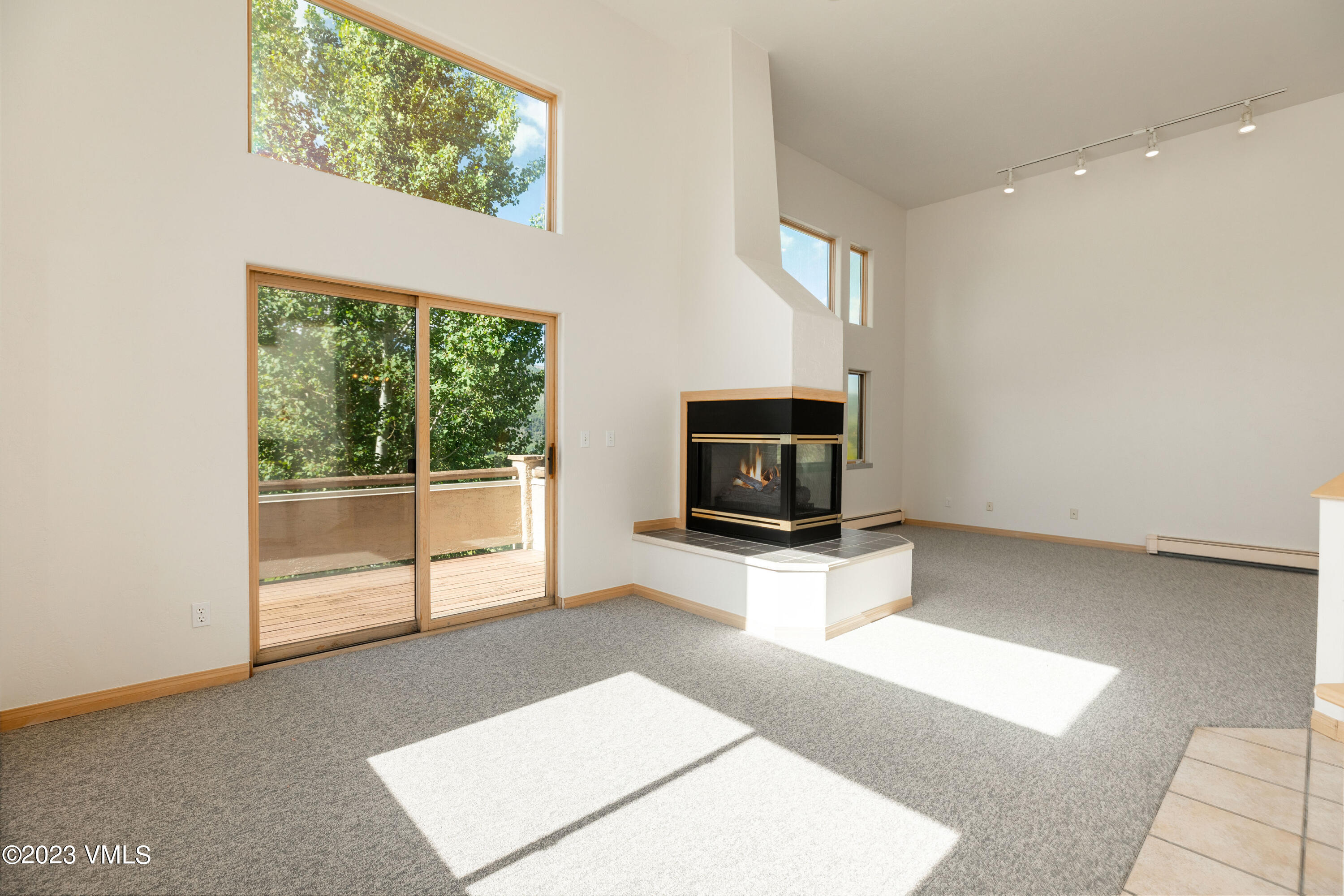 751 Singletree Road, Unit 3 Edwards, CO 81632 - Photo 7 of 22 a living room with a flat screen tv and a fireplace