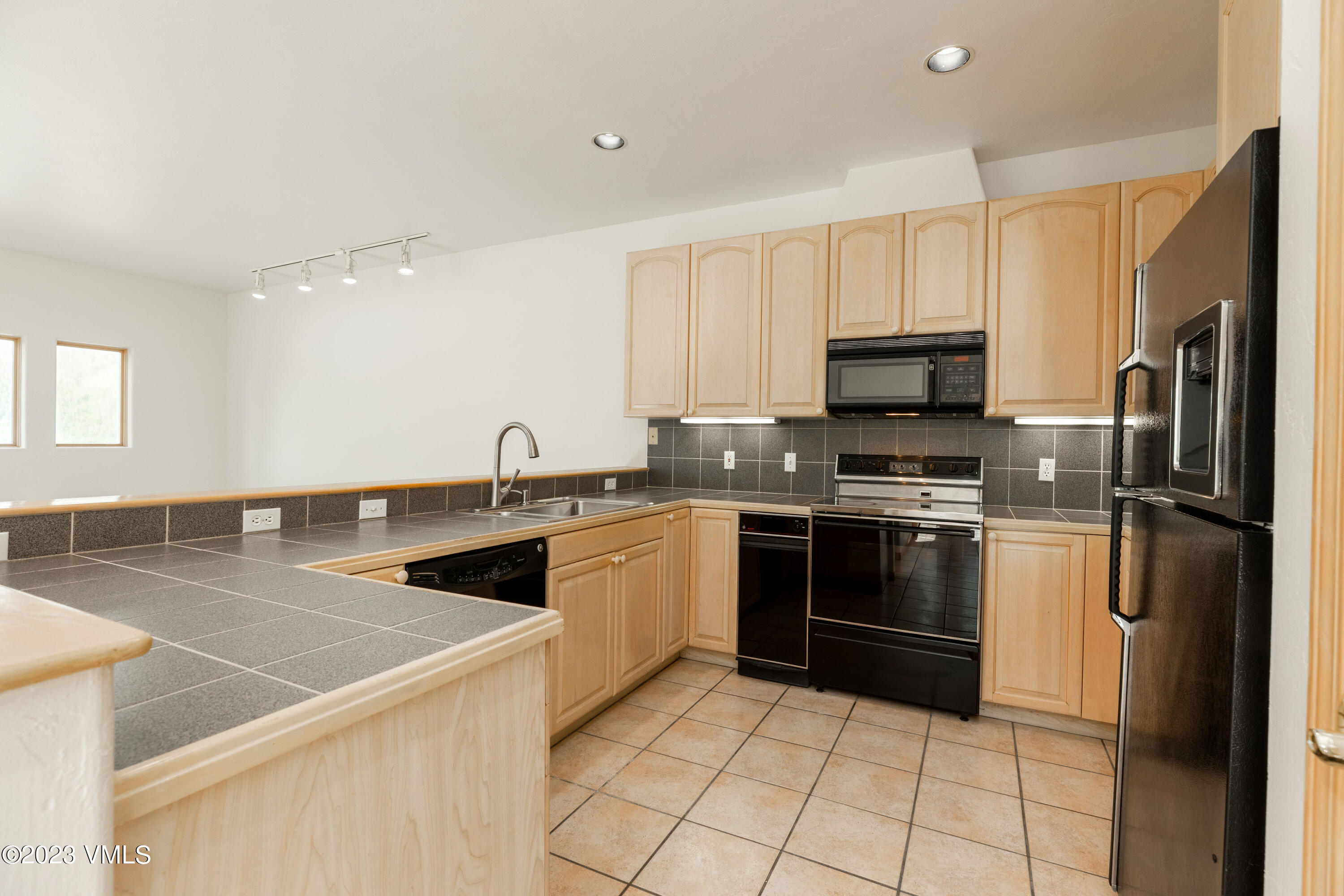 751 Singletree Road, Unit 3 Edwards, CO 81632 - Photo 8 of 22 a kitchen with a sink a stove and refrigerator