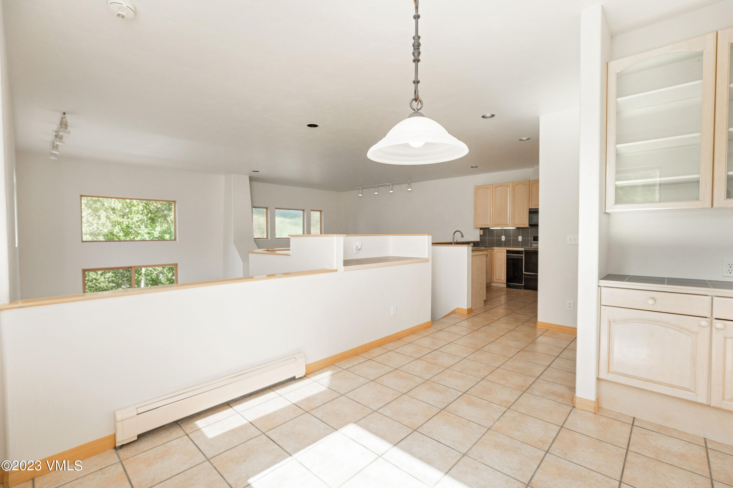 751 Singletree Road, Unit 3 Edwards, CO 81632 - Photo 9 of 22 a kitchen with stainless steel appliances a refrigerator sink and cabinets